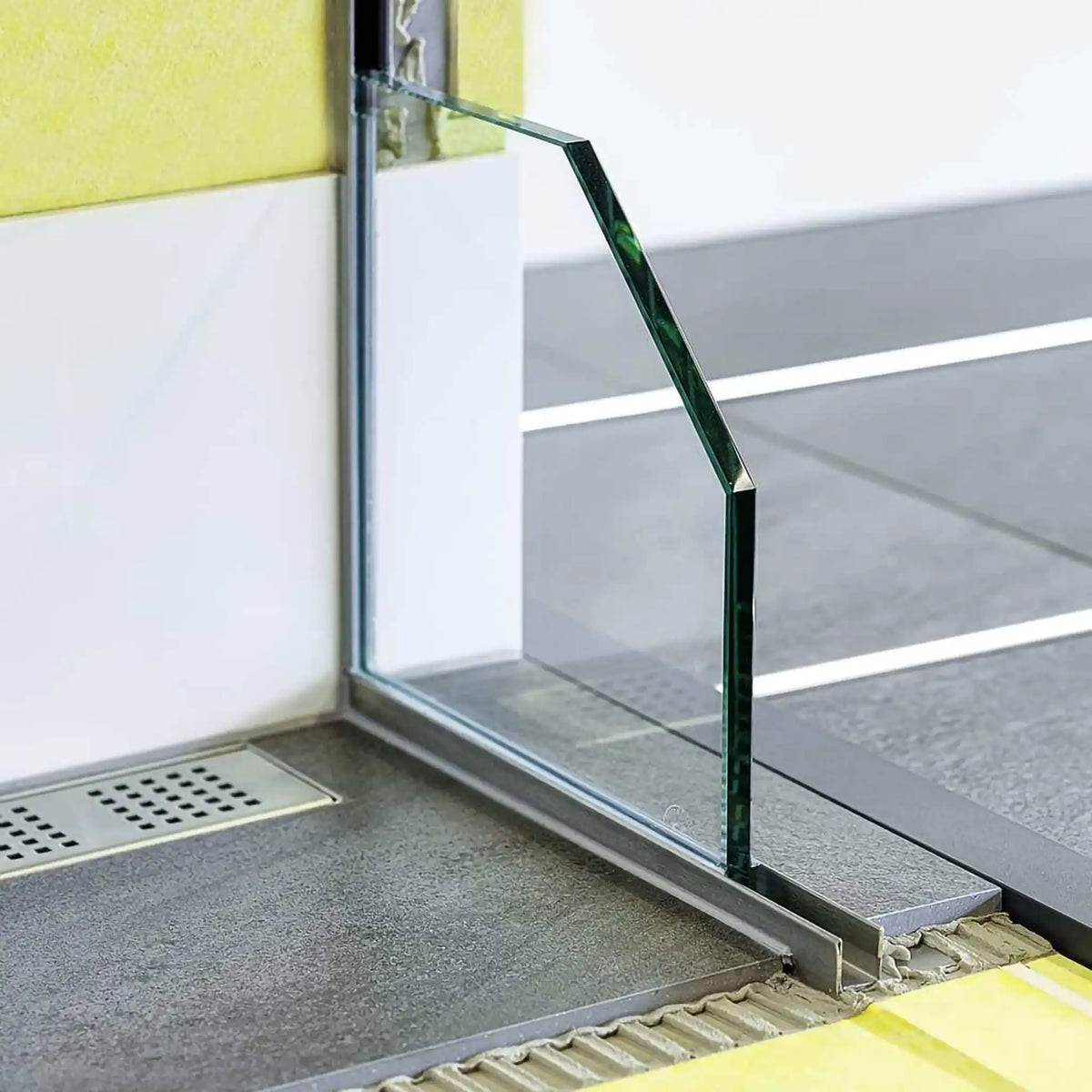 DURAL slope wedge glass mount installed in shower with fitted glass