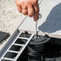 Ambience image where the pedestal supports are adjusted from above with an adjustment key.