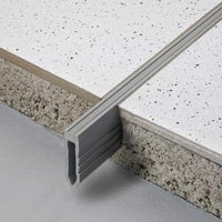 Expansion joint profile made of PVC installed in thick bed. A short piece is not incorporated in the thick bed