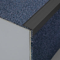 Step profile made of aluminium matt black in L-shape with grooved surface on a staircase with carpet #A0005115 #A0005116